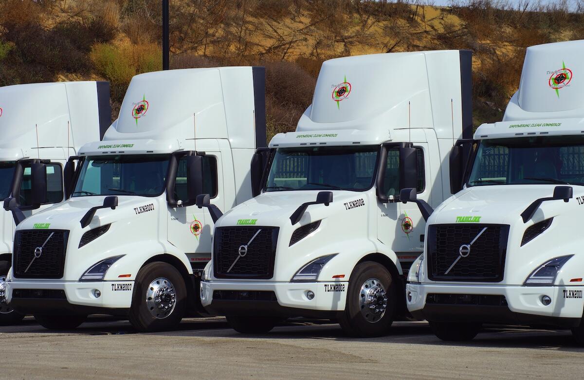 Fleet of modern electric freight trucks lined up